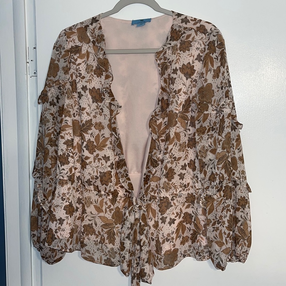 Light pink frilly blouse with floral pattern